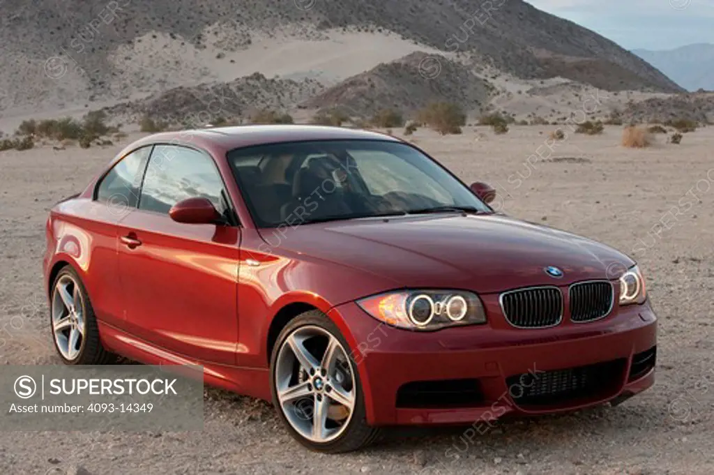 BMW 135i parked in desert setting, side view
