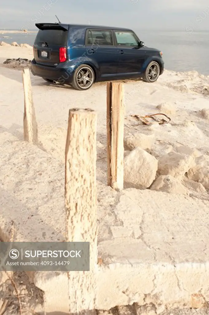 2008 Toyota Scion xB parked on sand, rear 7/8