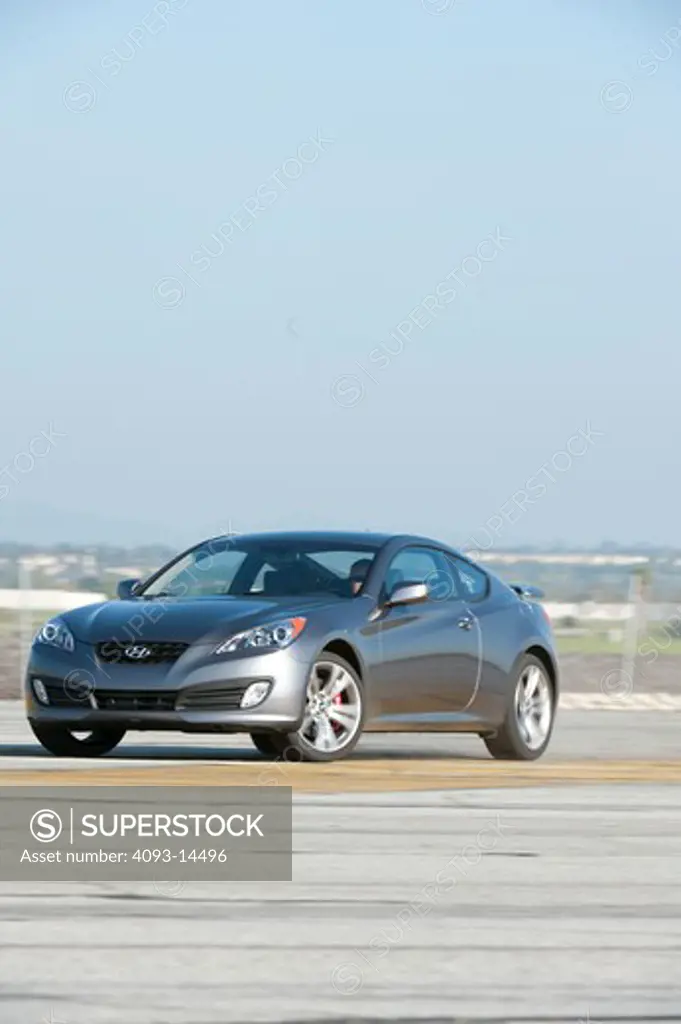 2010 Hyundai Genesis Coupe 2.0T front 3/4 on road