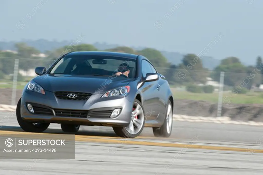 2010 Hyundai Genesis Coupe 2.0T, front 3/4 on road