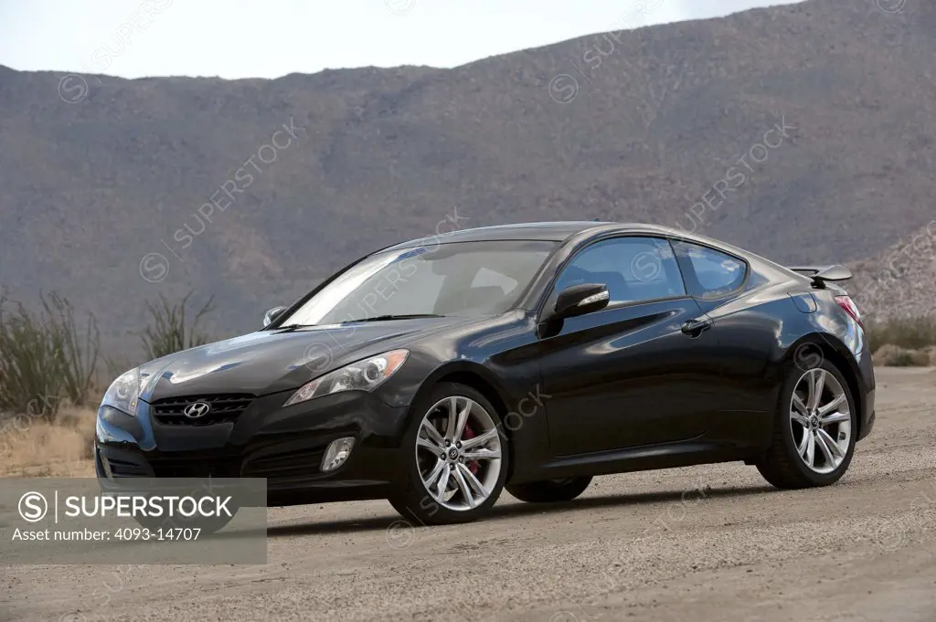 2010 Hyundai Genesis Coupe 3.8 V-6 on road, front 7/8