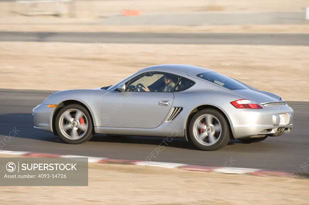 2008 Porsche Cayman S on road, side view