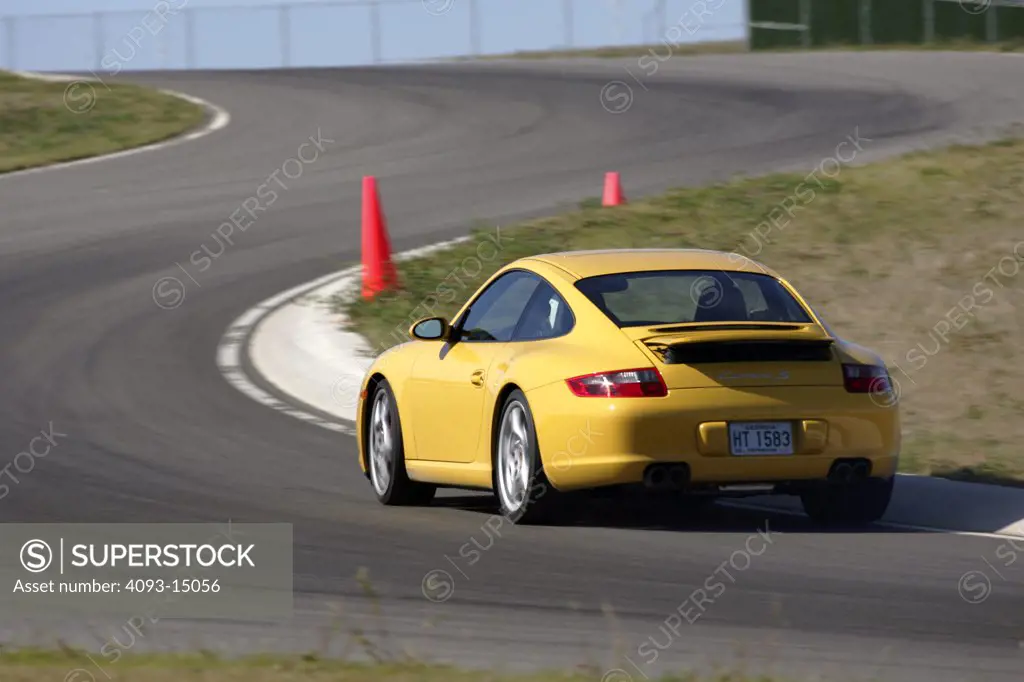 Porsche 911 2005 yellow cornering handling orange cone