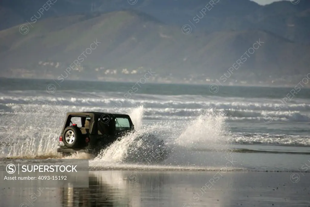 2002 Jeep Wrangler water splash wheeling through water ocean