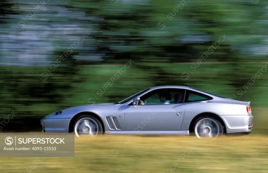 Ferrari 1997 550 Maranello silver profile dry grass trees blur 1990s