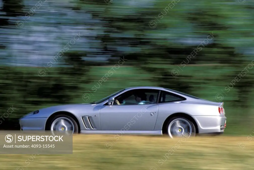 Ferrari 1997 550 Maranello silver profile blur dry grass trees 1990s