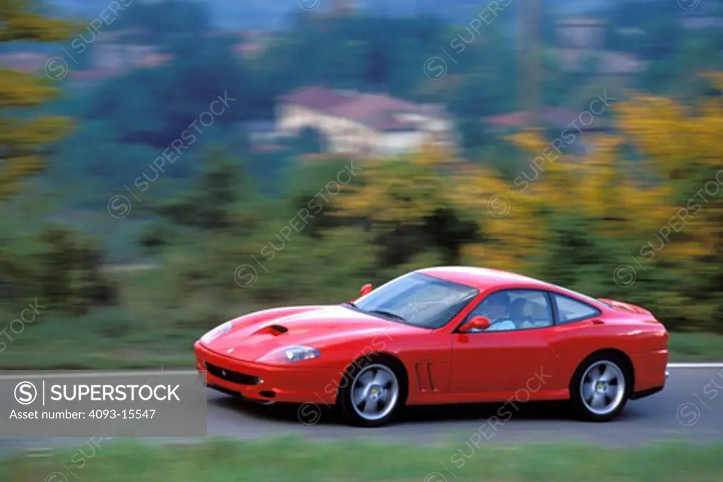 Ferrari 1997 550 Maranello red front 3/4 profile asphalt grass trees 1990s street