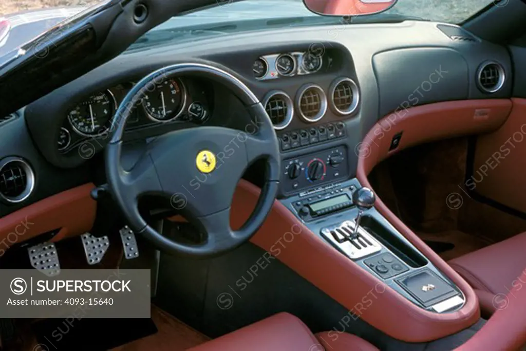 interior Ferrari 2002 550 Barchetta Pininfarina silver grey detail red leather steering wheel gear shift IP instrument panel dashboard gauges speedometer tachometer pedals air vents badge logo street