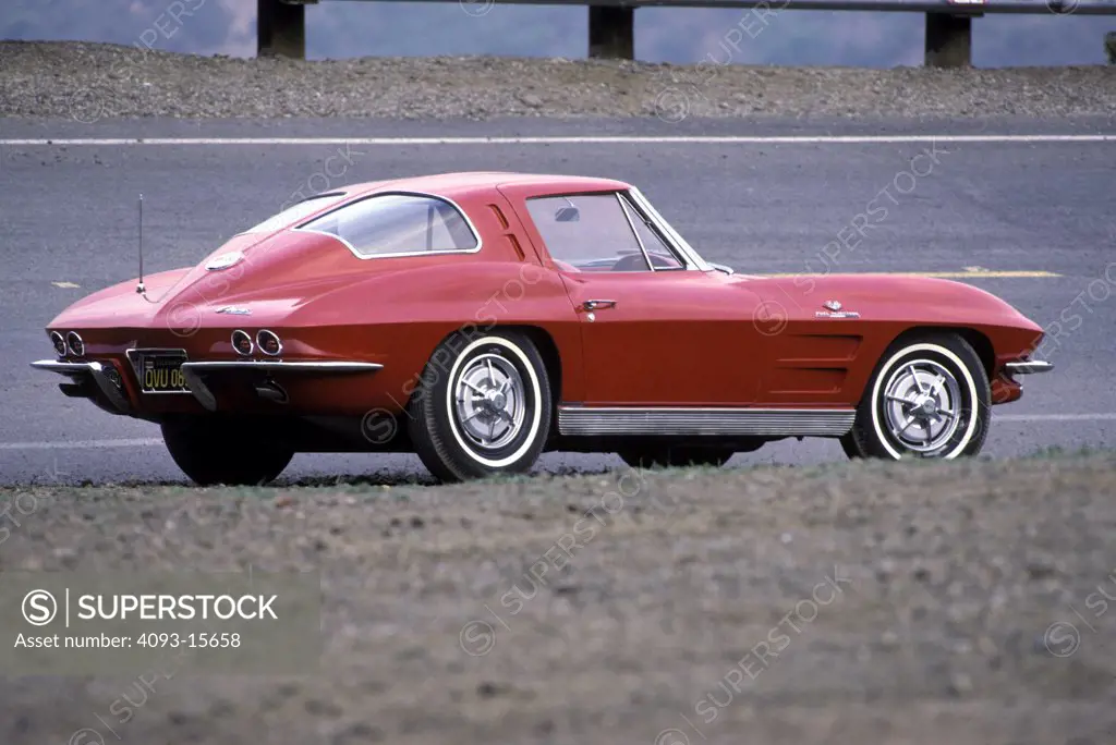 Corvette Stingray 1963 1960s red Chevy shoulder street