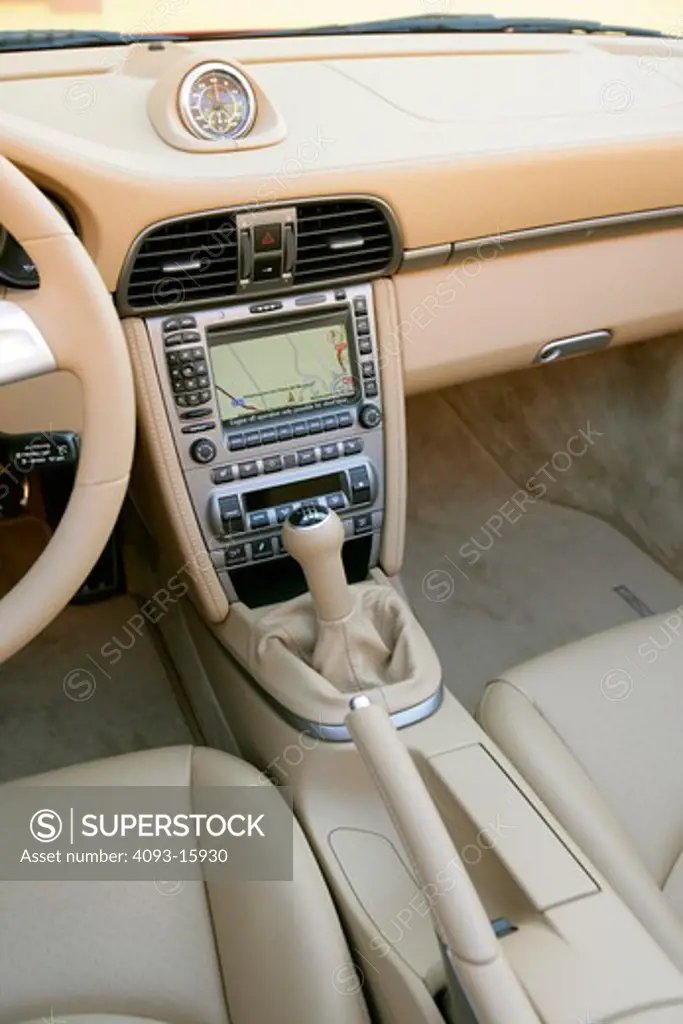 interior Porsche 911 Carrera 2006 tan leather seats gear shift dashboard nav screen