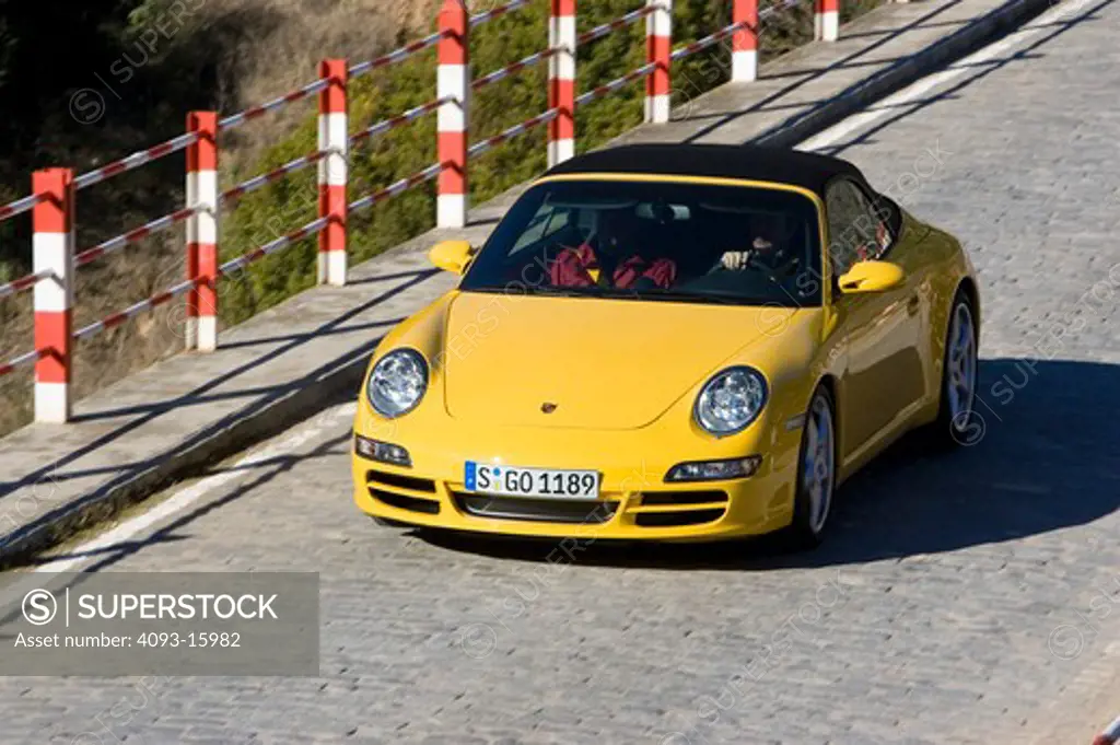 high angle Porsche 911 Carrera S 2006 yellow pylons