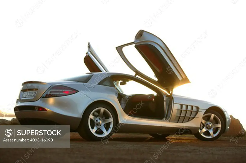 low angle Mercedes Benz SLR McLaren 2005 silver open doors