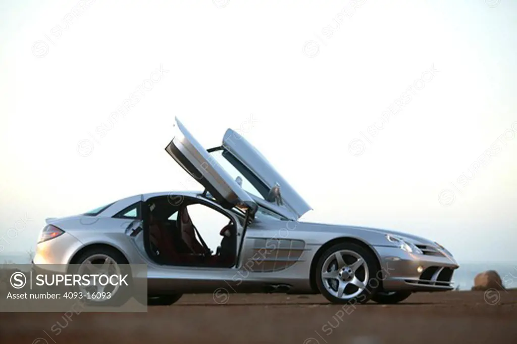 low angle Mercedes Benz SLR McLaren 2005 silver open doors