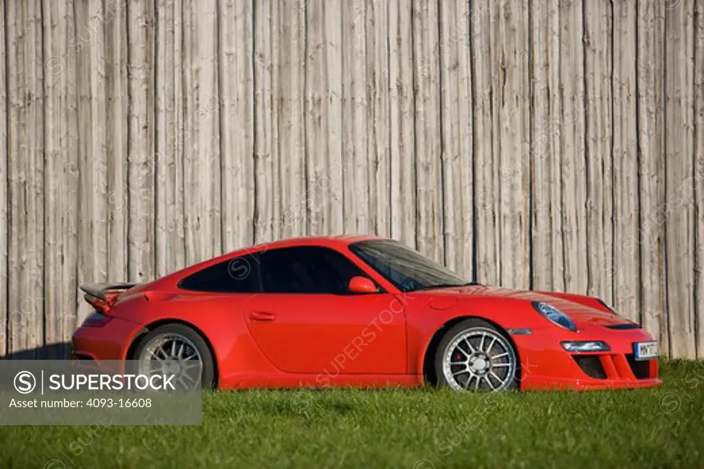 A profile view of a 2007 Ruf Porsche RT12. introduced the model in Fall 2004 at the Essen Motor Show as the first of their offerings built on Porsche's new 997 platform. A twin-turbocharged, 3.6 litre flat-six cylinder engine based on the previous 996 series Turbo engine provides 530 and 560 Bhp options while the bored-out 3.8 litre option produces 650 bhp. The Rt 12 features specially developed RUF bodywork, giving the vehicle a unique appearance while functioning to increase downforce, improvi