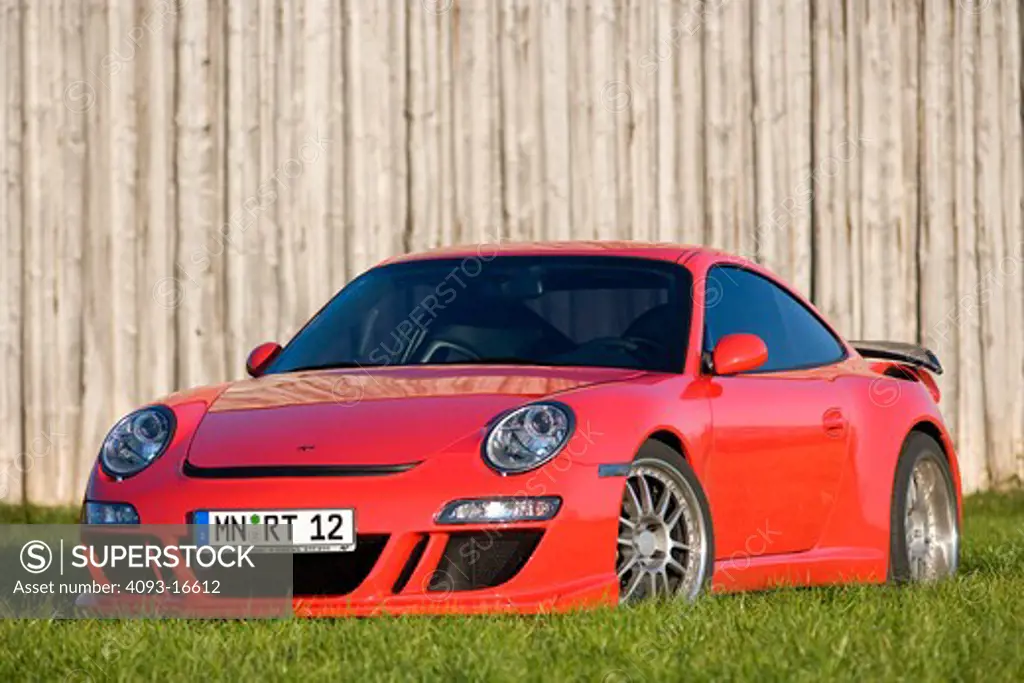 Front 3/4 view of a 2007 Ruf Porsche RT12. introduced the model in Fall 2004 at the Essen Motor Show as the first of their offerings built on Porsche's new 997 platform. A twin-turbocharged, 3.6 litre flat-six cylinder engine based on the previous 996 series Turbo engine provides 530 and 560 Bhp options while the bored-out 3.8 litre option produces 650 bhp. The Rt 12 features specially developed RUF bodywork, giving the vehicle a unique appearance while functioning to increase downforce, improvi