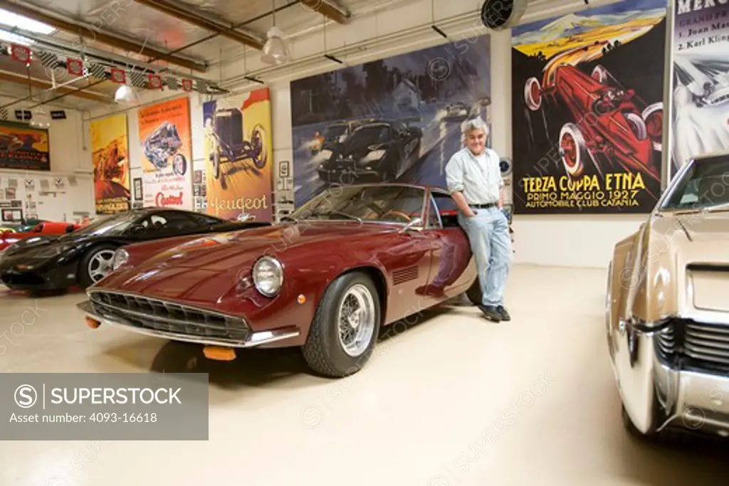 Jay Leno with some of the cars in his private garage. Shown here is the 1970 Monteverdi High Speed 375. Perhaps another way to think of hybrids is pure collaboration. In the case of Jays 1970 Monteverdi High Speed 375, its a blend of European style and American power. The Monteverdi had its lithe body and chassis designed by the legendary Carozzeria Fissore in Turin, Italy.