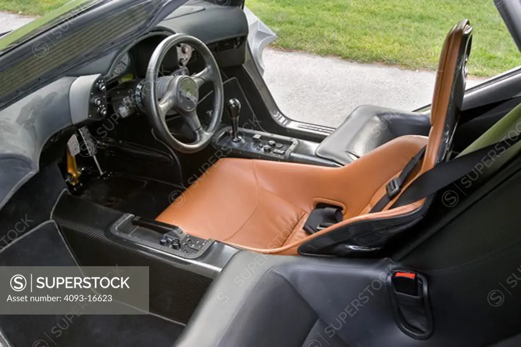 An interior view of the McLaren F1. It was the fastest street legal production car in the world of its time. It was engineered and produced by McLaren Automotive, a subsidiary of the British McLaren Group that, among others, owns the McLaren Mercedes Formula One team. The car features a 6.1-litre 60° BMW S70 V12 engine and it was conceived as an exercise in creating what its designers hoped would be considered the ultimate road car. Only 100 cars were manufactured, 64 of those were street versio
