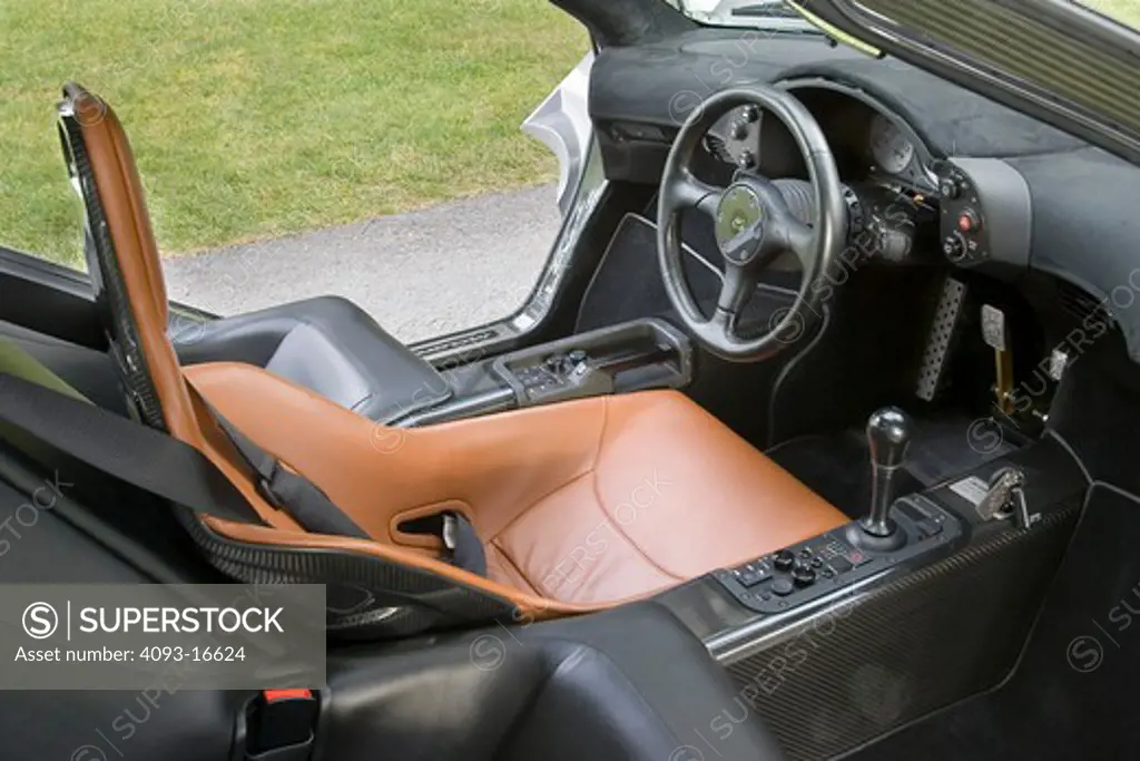 An interior view of the McLaren F1. It was the fastest street legal production car in the world of its time. It was engineered and produced by McLaren Automotive, a subsidiary of the British McLaren Group that, among others, owns the McLaren Mercedes Formula One team. The car features a 6.1-litre 60° BMW S70 V12 engine and it was conceived as an exercise in creating what its designers hoped would be considered the ultimate road car. Only 100 cars were manufactured, 64 of those were street versio