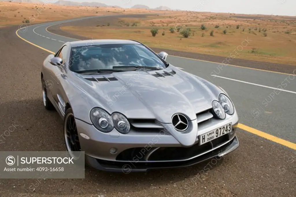 A front 3/4 view of the 2007 Mercedes-Benz McLaren SLR 722. The 722 refers to the victory by Stirling Moss and his co-driver Denis Jenkinson in a Mercedes-Benz 300 SLR with the starting number 722 (indicating a start time of 7:22 a.m.) at the Mille Miglia in 1955. The 722 Edition creates 650 bhp, with a top speed of 337 km/h (5 more than the standard SLR). A new suspension is used with 19-inch light-alloy wheels, a stiffer damper configuration and 0.4 inches lower body. The SLR is planned to end