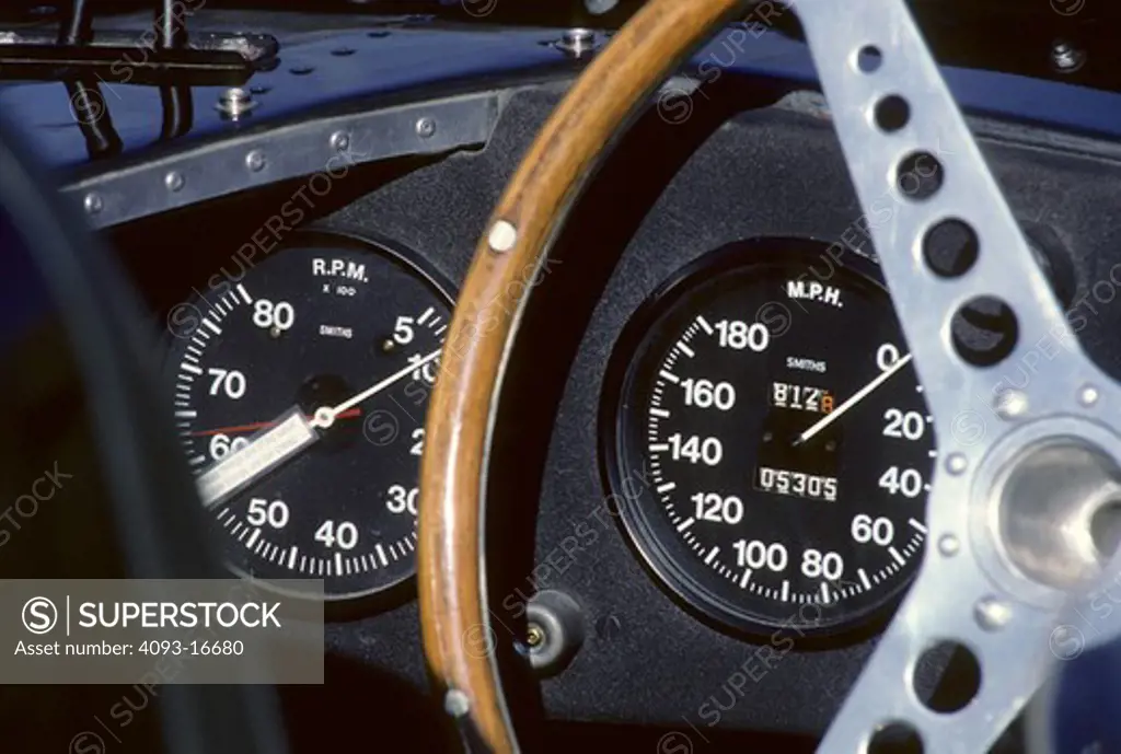 1955 Jaguar XK D-type interior detail gauges. Specifically showing the speedometer and tachometer. The Jaguar D type, like its predecessor was a factory-built race car. Although it shared the basic straight-6 XK engine design (uprated to 3.8 litres) with its predecessor, the majority of the car was radically different. Perhaps its most ground-breaking innovation was the introduction of a monocoque chassis, which not only introduced aircraft-style engineering to competition car design, but also a