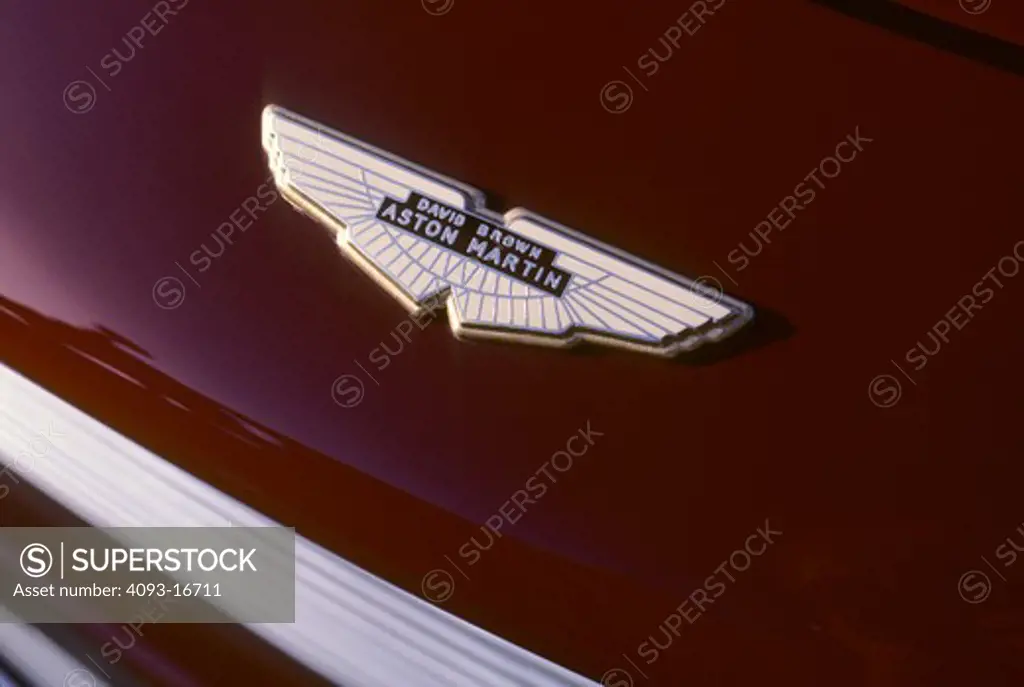 1962 Aston Martin DB4 Series 5 badge detail. A tiny number of non-GT DB4s used the GT's more-powerful engine. Available in 3.7 L (3670 cc/223 in¬) and 3.8 L (3750 cc/228 in¬) versions, the GT's engine had twin sparkplugs per cylinder with two distributors and three twin-choke Weber carburettors. Modifications to the cylinder head brought compression to 9.0:1 and power output was 302 hp (225 kW). Maximum speed for the GT was 153 mph (246 km/h) with a 6.1 second sprint to 60 mph (97 km/h). This 