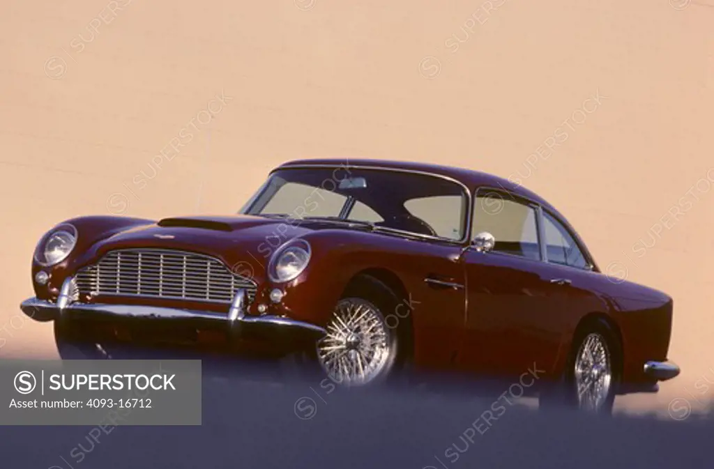 1962 Aston Martin DB4 Series 5 beauty front 3/4. A tiny number of non-GT DB4s used the GT's more-powerful engine. Available in 3.7 L (3670 cc/223 in¬) and 3.8 L (3750 cc/228 in¬) versions, the GT's engine had twin sparkplugs per cylinder with two distributors and three twin-choke Weber carburettors. Modifications to the cylinder head brought compression to 9.0:1 and power output was 302 hp (225 kW). Maximum speed for the GT was 153 mph (246 km/h) with a 6.1 second sprint to 60 mph (97 km/h). T
