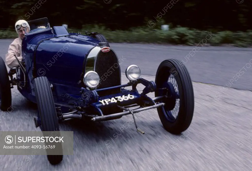 Bugatti Type37 Rene Dreyfus nose front 3/4 action. Ren© Dreyfus (born May 6, 1905 - died August 16, 1993) was a French driver who raced automobiles for 14 years in the 1920s and 1930s, the Golden Era of Grand Prix motor racing.  The Type 35 chassis and body were reused on the Type 37 sports car. Fitted with a new 1.5 L (1496 cc/91 in¬) straight-4 engine, 290 Type 37s were built. This engine was an SOHC 3-valve design and produced 60 hp (44 kW). The same engine went on to be used in the Type