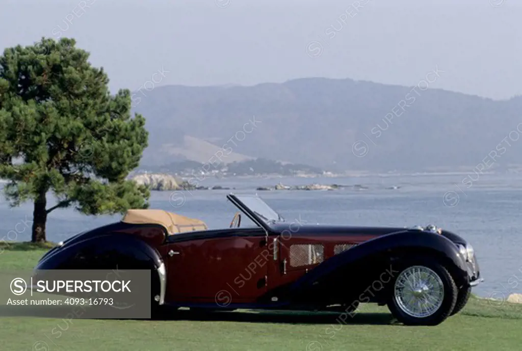 1937 Bugatti Type 57S Gangloff beauty profile. The Type 57 S / SC is one of the best-known Bugatti cars. The S stood for surbaissé (lowered), though most felt it stood for sport. It included a v-shaped dip at the bottom of the radiator and mesh grilles on either side of the engine compartment.  Lowering the car was a major undertaking. The rear axle now passed through the rear frame rather than riding under it, and a dry-sump lubrication system was required to fit the engine under the new low