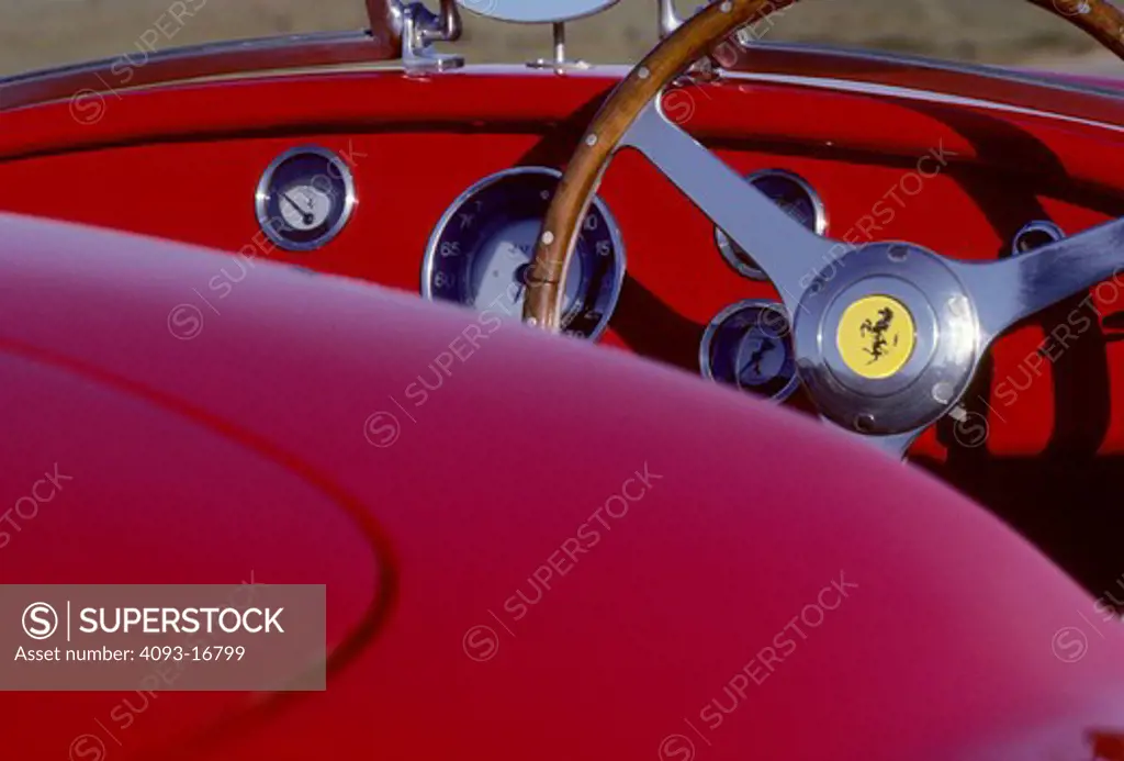 1951 Ferrari 166 MM Barchetta interior detail beauty cockpit Lusso touring race car. The 166 MM Touring Barchetta, a Ferrari masterpiece, still increase pulse rates fifty-five years later. It is the first Ferrari sports car; all previous cars were strictly for racing. Craftsmen welded a tubular frame with a 2,200 mm wheelbase to hand-formed body panels. Beneath the hood resides a Colombo designed 1,995 cc 60-degree V-12. The 166 MM was arguably the world's fastest sports car in its day. In the h