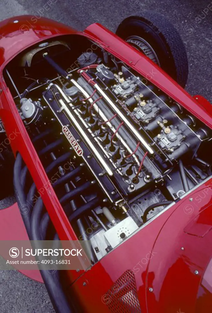 1957 Maserati 250F race car beauty engine detail. The Maserati 250F (first raced January 1954 - last raced November 1960) was a racing car made by Maserati of Italy, used in '2.5 litre' Formula One racing (thus, the '250' and 'F'). 26 examples were made in total. It was introduced for the 1954 Formula One season and remained in use by customer teams until 1960.  The Maserati is on the old Reims race track. Between 1925 and 1969, Reims hosted the Grand Prix de la Marne automobile race at a circ