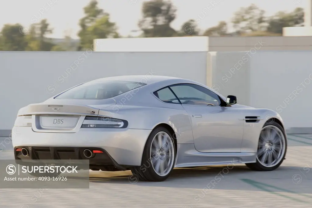 2007 Aston Martin DBS v12  Aston Martin DBS is a high performance sports car from the UK manufacturer Aston Martin 6.0 V12 engine on top of a parking structure buildings in the background downtown