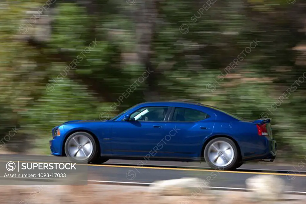 2009 Dodge Charger SRT8.  The Dodge Charger, is a rear-wheel drive full-size automobile outdoors in hills in California