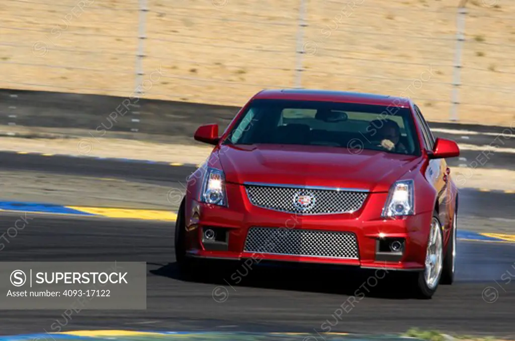 2009 Cadillac CTS-V driving on race track, front view