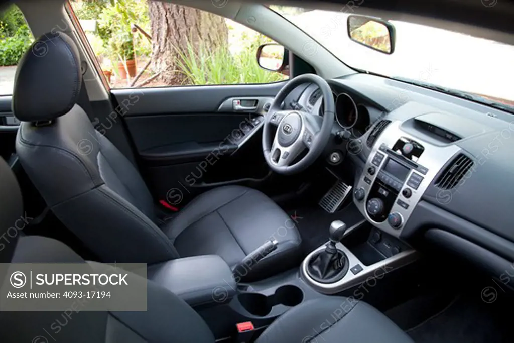Interior view of a 2010 red Kia Forte