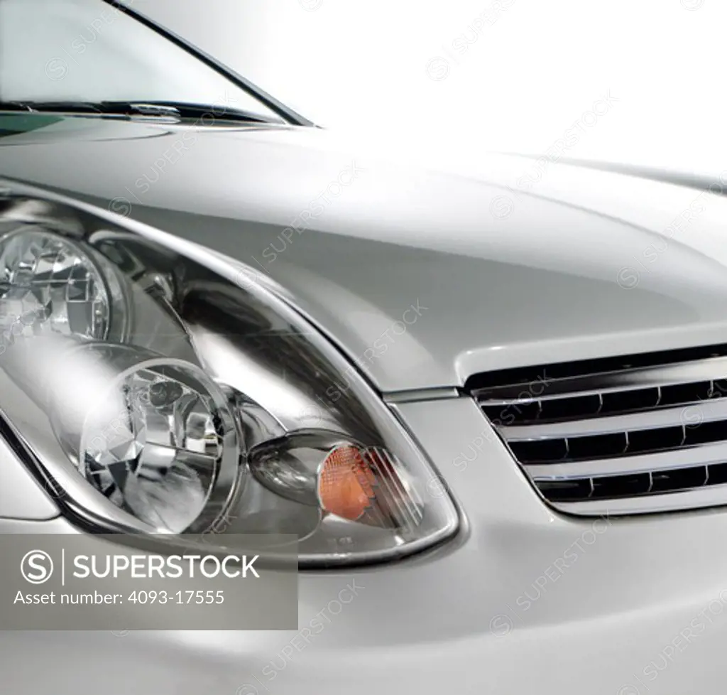 Silver 2006 Infiniti G35 G 35 headlight detail photographed in the studio with a white background.