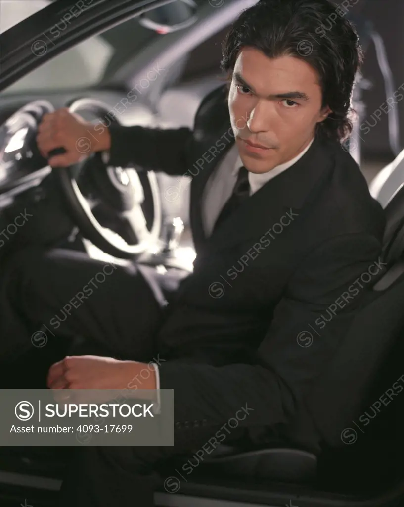 BMW M3 2002 guy inside dressed nice business suit