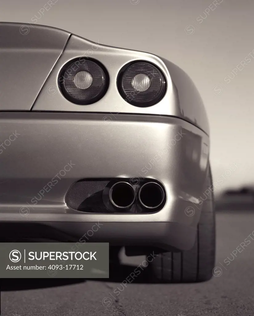 detail Ferrari 550 Maranello 2000 tail light exhaust pipes straight on twin tailpipes exhaust bumper street