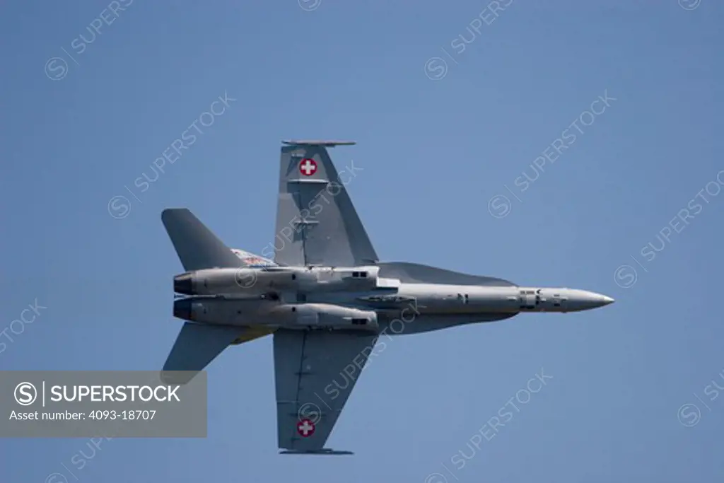 Red Bull Airshow over Salzberg, Austria. McDonnell Douglas ( now Boeing ) F18 A18 F/A-18 Hornet performing low altitude maneuvers. In flight flying