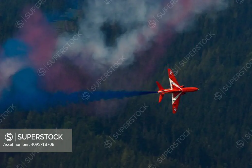 Red Bull Airshow over Salzberg, Austria. The BAE Systems (BAE) Hawk is an advanced jet trainer which first flew in 1974 as the Hawker Siddeley Hawk. It is used by the Royal Air Force, and other air forces, as either a trainer or a low-cost combat aircraft. In flight flying