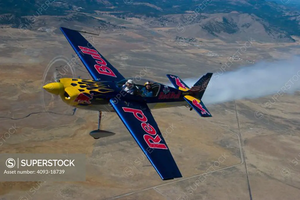 Red Bull Race planes at the Reno Air Races, Reno Stead Airport, Reno, Nevada. The Red Bull Air Race World Series, established in 2003 and created by Red Bull, is an international series of air races with the participation of the world's most skilled pilots, in which competitors have to navigate a challenging obstacle course in the sky, in the fastest possible time. Pilots fly individually against the clock and have to complete tight turns through a slalom course consisting of specially designed 