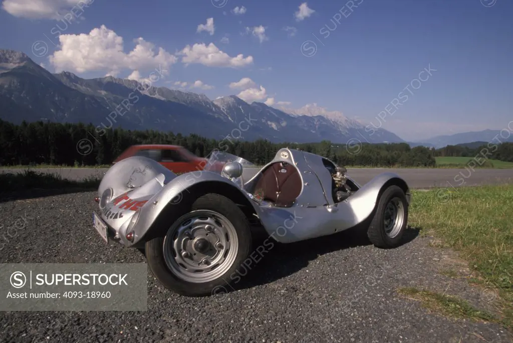 Porsche Mathe 1952 1950s single seater silver sky grass field race car street