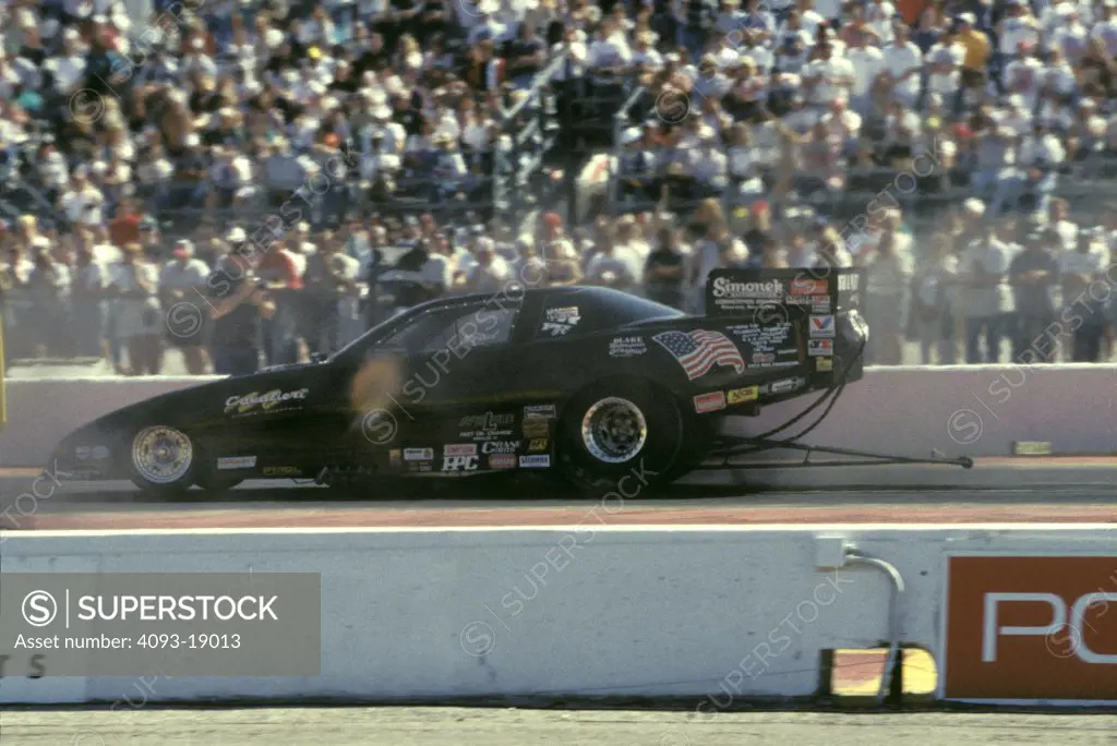 1997 NHRA Winter Nationals Ennis Texas drag racing dragster black profile stands bleachers crowd race car 1990s street