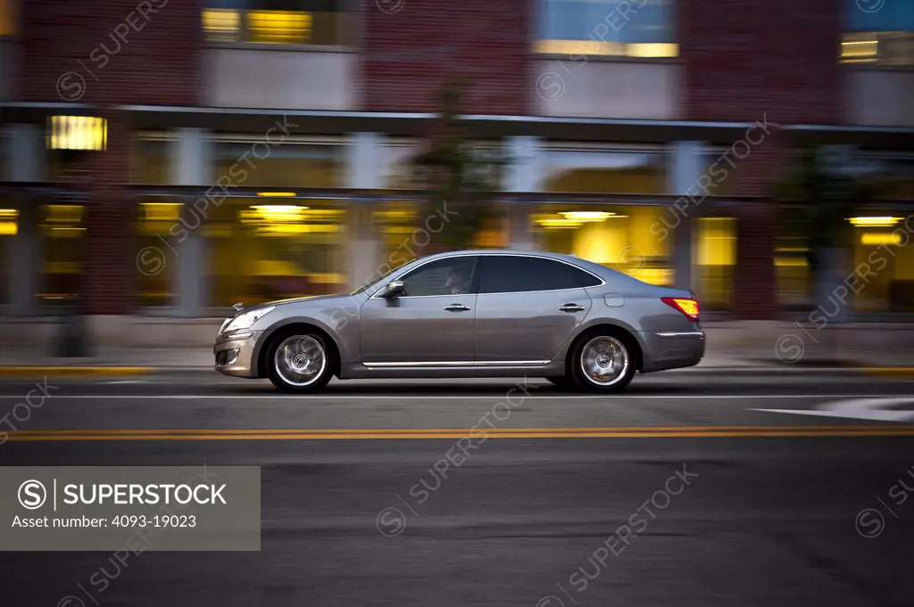 2011 Hyundai Equus driving in city, side view