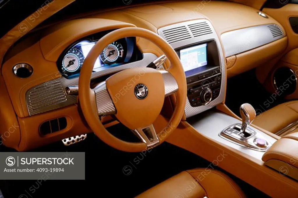 interior Jaguar Advanced Lightweight Coupe 2005 tan leather steering wheel gauges gear shift aluminum dashboard nav screen