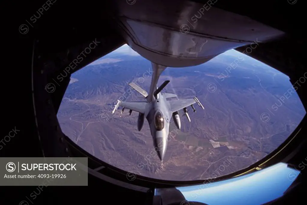 overhead detail Military Lockheed Martin Jets Fixed Wing Aviat Airplanes F-16C Fighting Falcon fighter in-flight refueling fuel transfer tanker