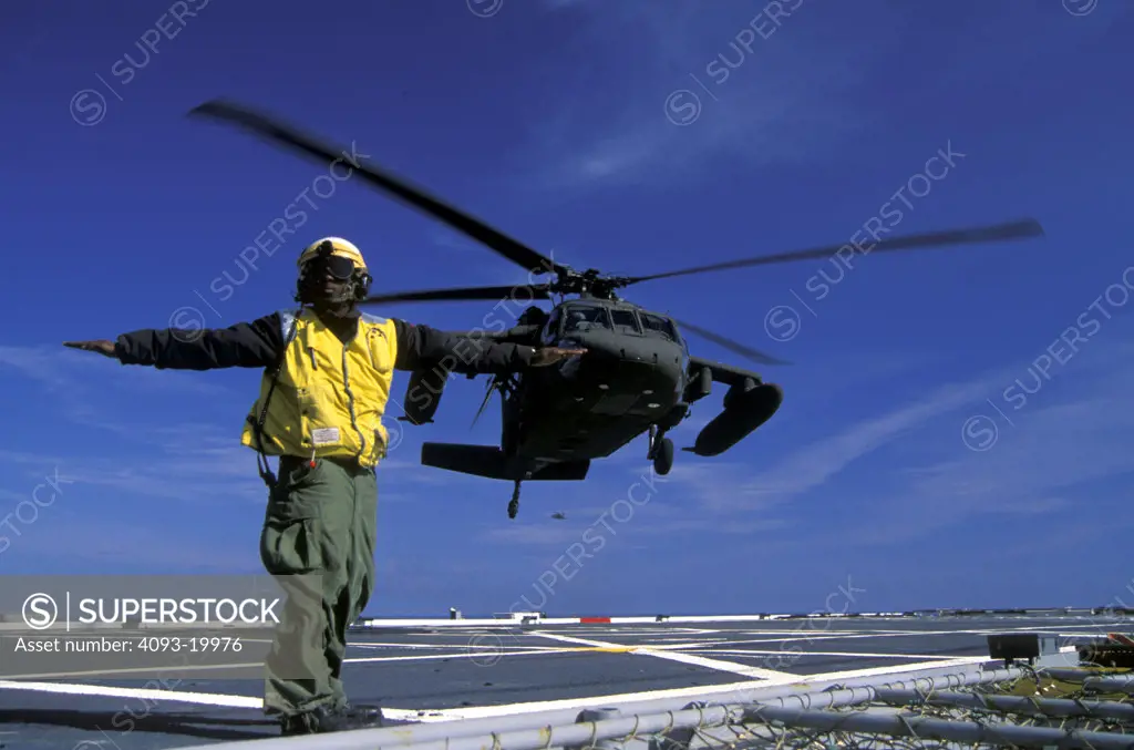 Sikorsky Military Helicopters Aviat UH-60A Black Hawk takeoff U.S. Army USS Juneau USN U.S. Navy aircraft carrier ship signalman