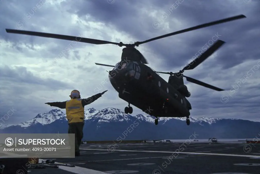 Military Helicopters Boeing Aviat CH-47D Chinook USS Juneau aircraft carrier USN U.S. Navy signalman takeoff landing
