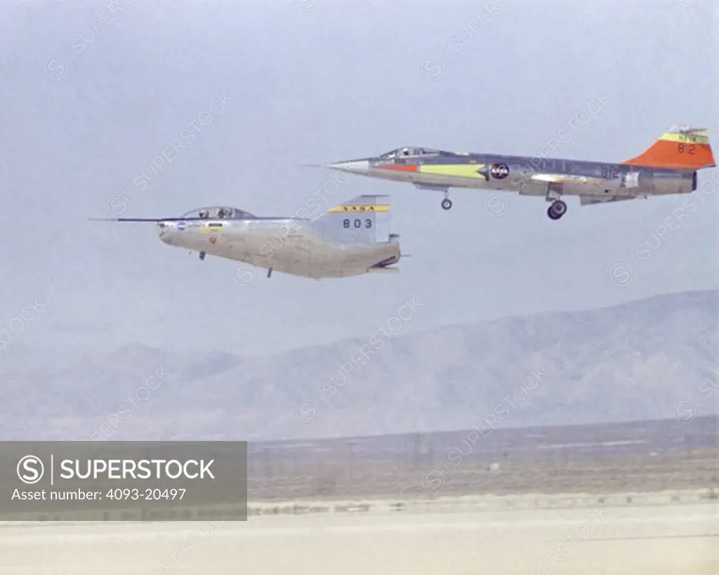 The Northrup M2-F2 lifting body returns from a research flight at the NASA Dryden Flight Research Center  Edwards  California  with a Lockheed F-104 flying chase. Landing