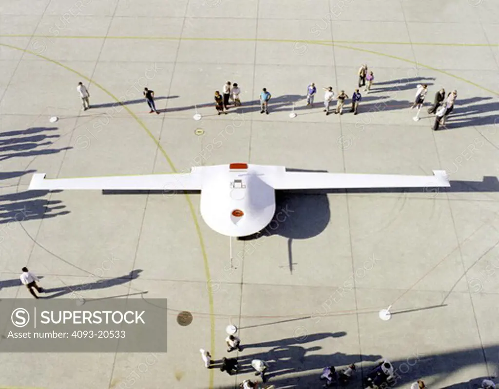 The Lockheed Martin/Boeing Tier III- (minus) unpiloted aerial vehicle is inspected by NASA personnel September 14  1995  following its arrival at the Dryden Flight Research Center  Edwards  California.