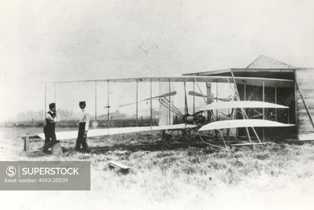 Wilbur and Orville Wright with the Flyer II at Huffman Prairie  outside of Dayton  Ohio  in May 1904.